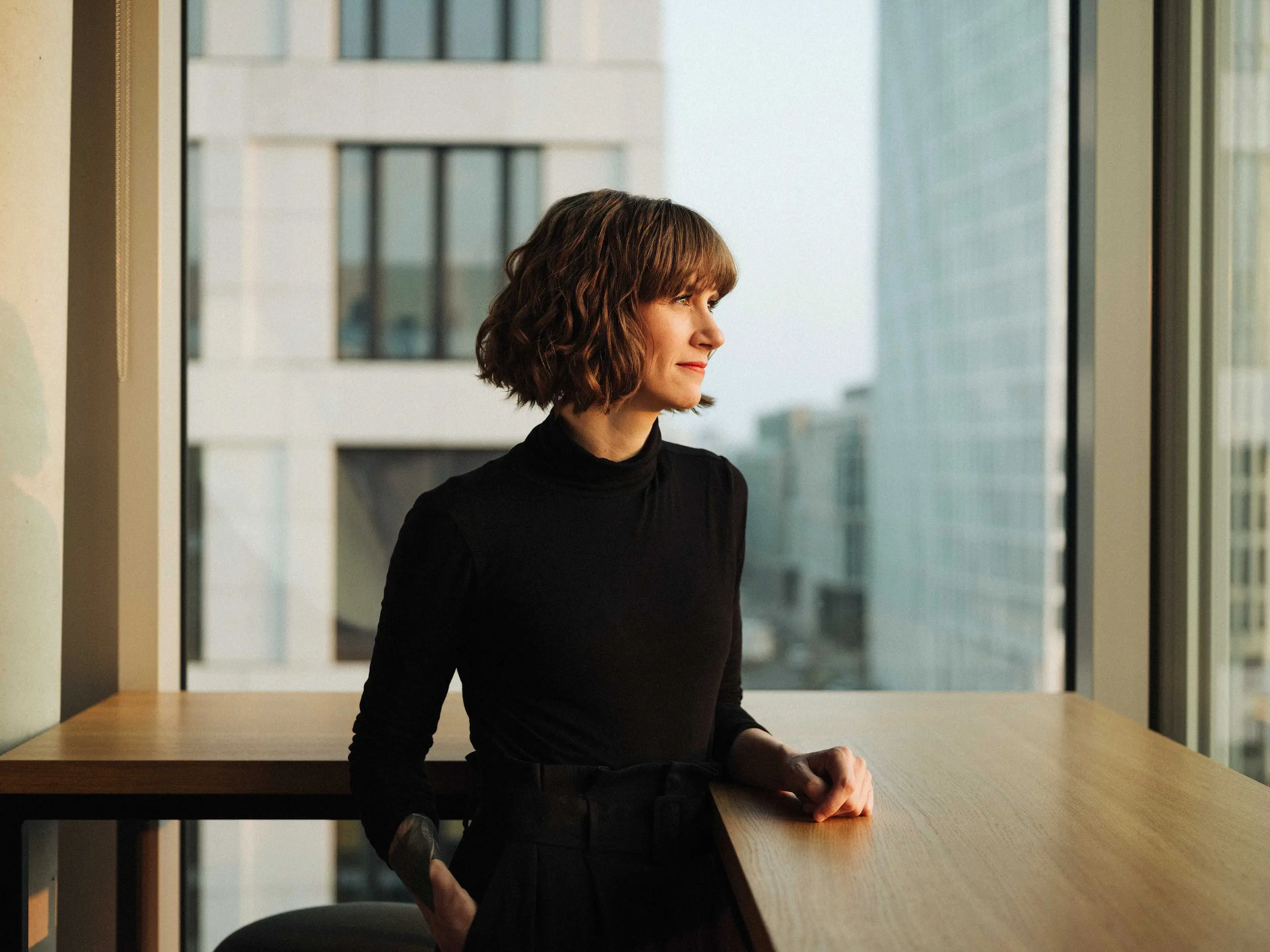 Woman looking out of window