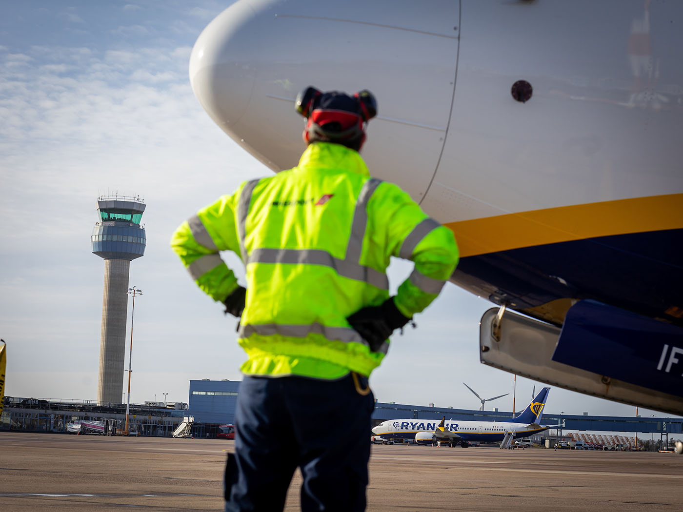 Person alongside plane