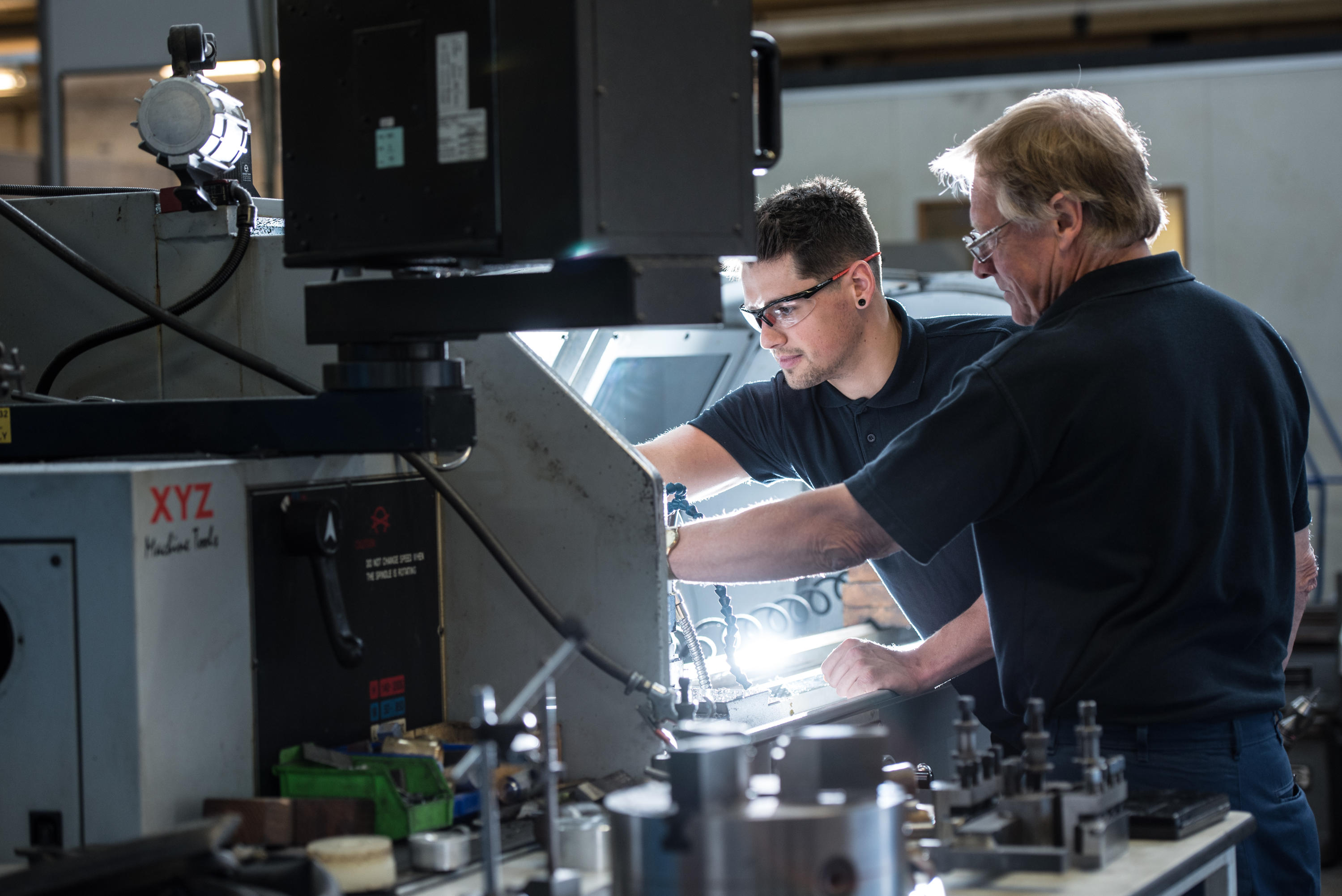 Staff members using equipment in engineering